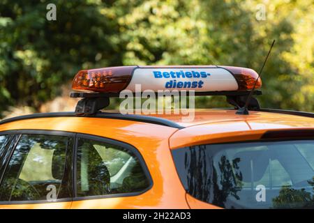 A warning bar with the German inscription Operating service on a car roof Stock Photo
