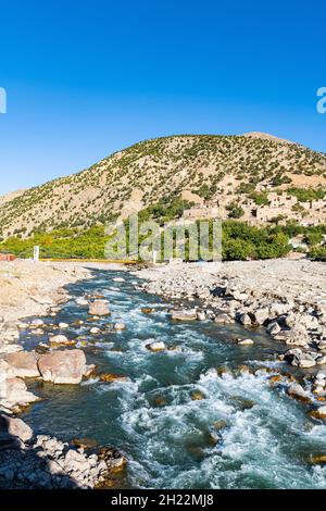 Panjshir river flowing through the Panjshir Valley, Afghanistan Stock Photo