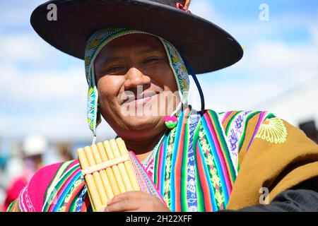 Indigenous man in traditional costume with pan flute during a parade, El Alto, La Paz Department, Bolivia Stock Photo