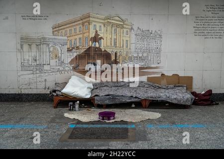 A rough sleeper’s bedding and personal belongings seen during the day in Hyde Park underpass. Stock Photo