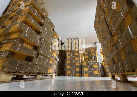 Cardboard boxes on a pallet, Rack stack arrangement of cardboard boxes in a store warehouse. Stock Photo