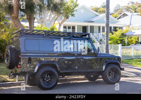 Black Land Rover defender 110 model parked in a Sydney street on a sunny day,NSW,Australia Stock Photo