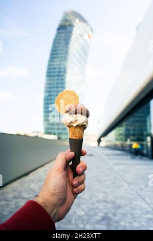 Man holding ice-cream in Milano, Italy Stock Photo