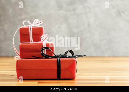 Stack of gift boxes on the wooden table. Love, gift and present concept. Stock Photo