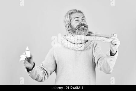 immune system help during epidemic. healthcare in winter. best cold remedy. helpful nasal spray. man use nasal drops during course of disease. happy Stock Photo