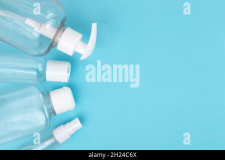 Used coronavirus materials lays on blue isolated background. Waste management and medical pollution concept. Stock Photo