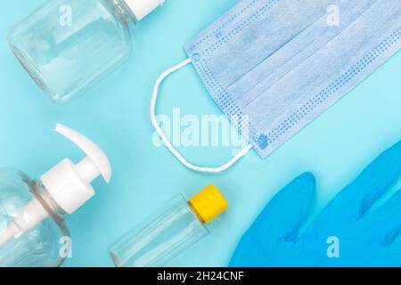 Used coronavirus materials lays on blue isolated background. Waste management and medical pollution concept. Stock Photo