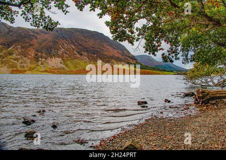 Serene Crummock Water, with Mellbeck and High Stile in the background on the way to Honnister Pass, Lake District National Park, Cumbria, England, UK Stock Photo