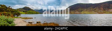 Serene Crummock Water, with Mellbeck and High Stile in the background on the way to Honnister Pass, Lake District National Park, Cumbria, England, UK Stock Photo