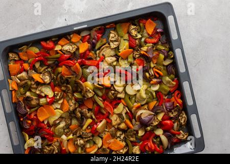 Fresh assorted autumn cut vegetables on a baking sheet, oven baked vegetables, top view Stock Photo