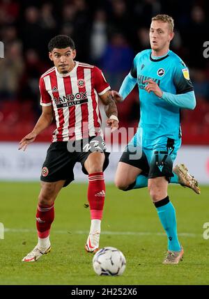 Sheffield, England, 19th October 2021. Morgan Gibbs-White of Sheffield Utd (L) is challenged by George Saville of Millwall during the Sky Bet Championship match at Bramall Lane, Sheffield. Picture credit should read: Andrew Yates / Sportimage Stock Photo