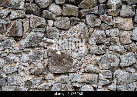 Natural stone wall made from field stones Stock Photo