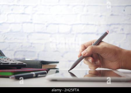 women's hand working on digital tablet with graphic pen  Stock Photo