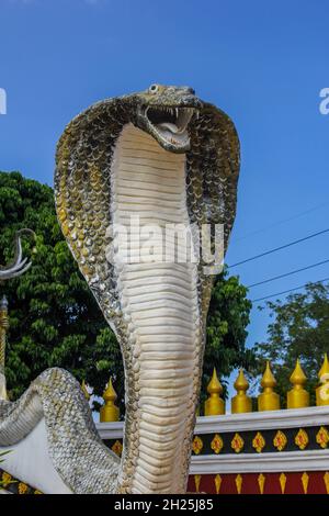 Mythical serpent of Thailand.Naga statue protecting the entrance to Thai temple.Cobra Snake Statue in temple in bangkok, thailand. Stock Photo