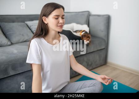 Muslim woman meditating in Lotus pose - a Royalty Free Stock Photo from  Photocase
