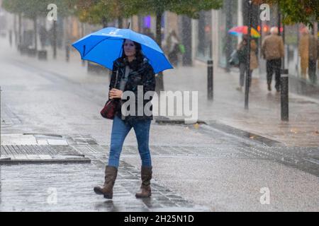 Preston, Lancashire. UK Weather. 20 October 2021. Heavy sporadic showers drench shoppers in the city centre. Cloud building from the south-west, will bring heavy further blustery spells of rain. Another breezy day with strong gusts at times. Credit; MediaWorldImages/AlamyLiveNews Stock Photo