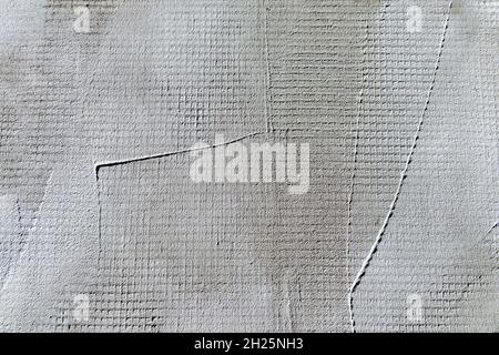 Plaster texture. Textured whitewash wall close-up with brush strokes. Stock Photo