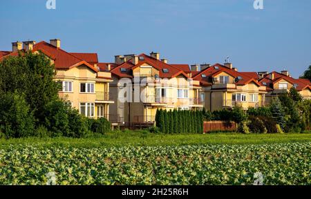 Warsaw, Poland - July 24, 2021: Panoramic view of residential estates near Las Kabacki Forest neighboring farming fields in Kabaty district of Warsaw Stock Photo