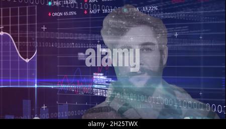 Financial data processing against man Stock Photo