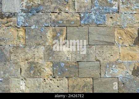 A flat on section of dressed stone wall using rectangular blocks Stock Photo