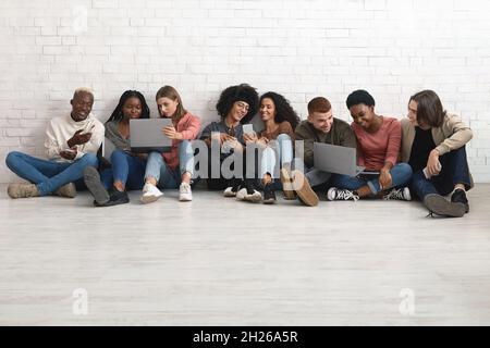 Creative students multiracial men and women working on project Stock Photo