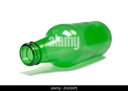 Empty green glass bottle against white background Stock Photo