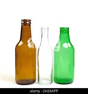 Various empty glass bottles against white background Stock Photo