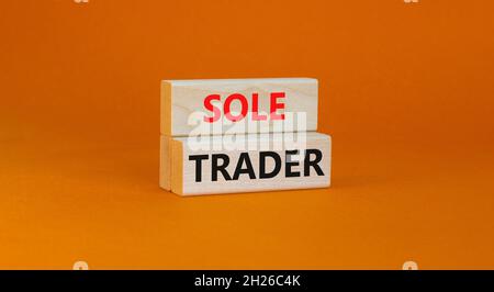 Time to sole trader symbol. Concept words Sole trader on wooden blocks on a beautiful orange background. Business and sole trader concept. Copy space. Stock Photo