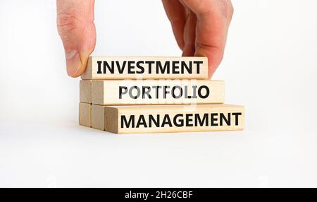 Investment portfolio management symbol. Concept words 'Investment portfolio management'. Businessman hand. Beautiful white background. Business, inves Stock Photo