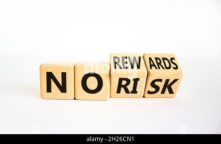 No risk or rewards symbol. Turned cubes and changed words 'no risk' to 'no rewards'. Beautiful white background. No risk or rewards and business conce Stock Photo