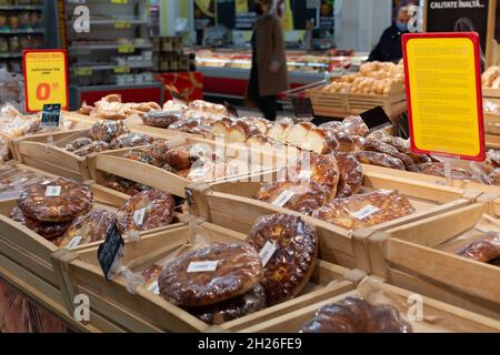 Chisinau, Moldova - October 17, 2021: Inside the Velmart supermarket. Showcase with fresh pastries. Selective focus, shallow depth of field. Stock Photo