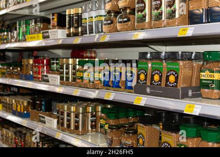 Chisinau, Moldova - October 17, 2021: Inside the Velmart supermarket. Showcase with assorted instant coffee. Stock Photo