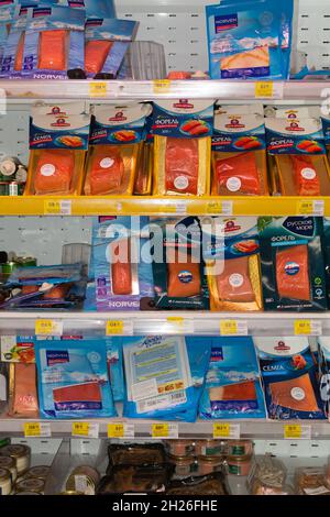 Chisinau, Moldova - October 17, 2021: Inside the Velmart supermarket. Showcase with red fish in the package: samga, trout, salmon Stock Photo