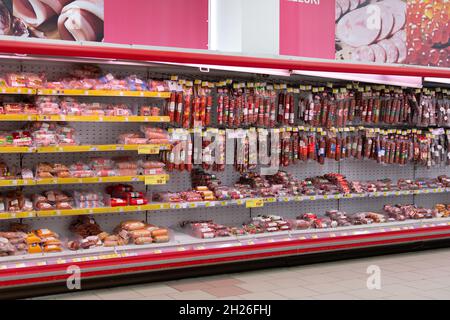 Chisinau, Moldova - October 17, 2021: Inside the Velmart supermarket. Showcase with sausages. Stock Photo