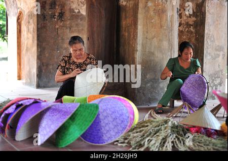 The beauty of conical hat artisans Stock Photo