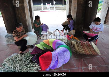 The beauty of conical hat artisans Stock Photo