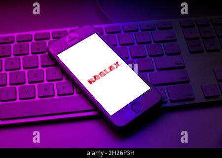 In this photo illustration the Roblox logo is seen on a smartphone screen  in front of Roblox website. (Photo by Pavlo Gonchar / SOPA Images/Sipa USA  Stock Photo - Alamy