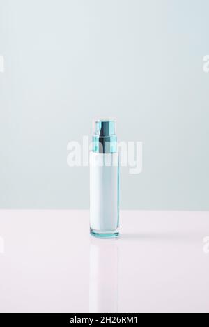 sunscreen on a white-blue background. minimalistic. Sunscreen. Stock Photo