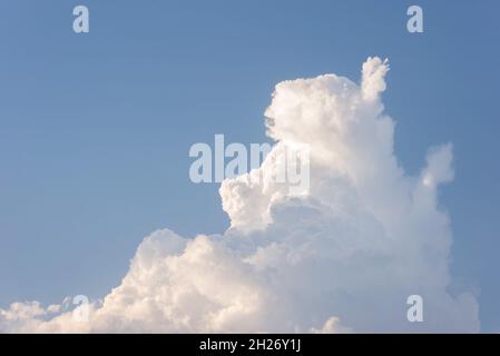 texture of thick clouds on a background of blue sky. Stock Photo