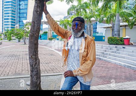Local black man posing on boulevard at the International Waterfront in Port of Spain, capital city of Trinidad and Tobago in the Caribbean Stock Photo