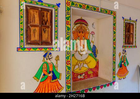 UDAIPUR, INDIA - FEBRUARY 12, 2017: Colorful murals in the City palace in Udaipur, Rajasthan state, India Stock Photo