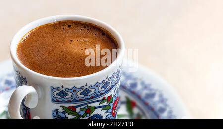 Top view photo of traditional turkish coffee with bubbles on isolated white background. Stock Photo