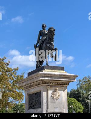 Statue of Joan Prim - A vertical low-angle view of bronze equestrian statue of General Joan Prim i Prats standing on stone pedestal, Barcelona, Spain. Stock Photo