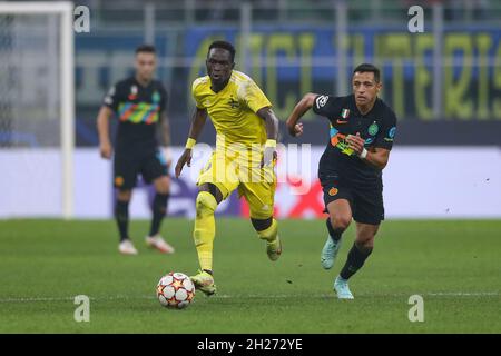 Milan, Italy, 19th October 2021. Adama Traore of Sheriff Tiraspol is pursued by Alexis Sanchez of FC Internazionale during the UEFA Champions League match at Giuseppe Meazza, Milan. Picture credit should read: Jonathan Moscrop / Sportimage Stock Photo