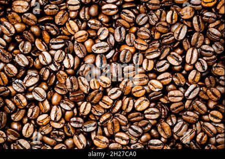 Roasted coffee or espresso beans background. Stock Photo
