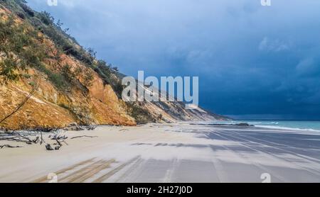 the coloured sand of the eroded sand dune cliffs of Rainbow Beach in the Cooloola Section of the Great Sandy National Park, Gympie Region, Qeensland, Stock Photo