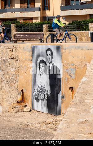 black and white wall painting of married couple from vintage photograph on a wall in Can Pastilla near Palma Mallorca Spain Stock Photo