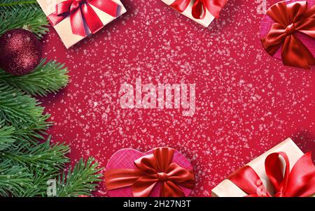 Fir branches with Christmas decorations on pink background. Holiday concept. Stock Photo