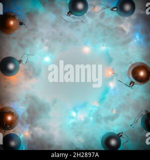 Colored Christmas balls lie on white soft cotton wool illuminated by a garland. Square aspect ratio Stock Photo