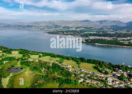 Aerial view of Garth Pier with snowdonia landscape in the distance from Anglesey Stock Photo